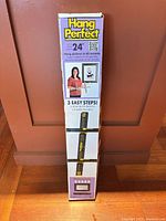 Front of boxed Hang It Perfect kit showing branding and 24 inch capacity