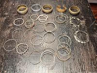 All bracelets and bangles laid out on table