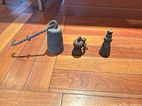All three cast-iron weights side by side