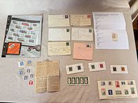 Overall view of stamps, souvenir sheet, postcards, mounts