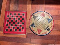 Square checkerboard and round Chinese Checkers board side by side