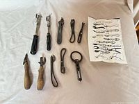 All ten can openers and leaflet laid out