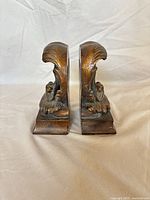 Front view of both shell motif bookends