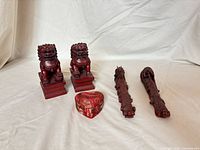 Group shot of four red guardian lion statues