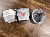 Three baskets side by side showing exterior designs and size comparison