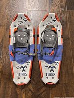 Top view of both snowshoes showing branding, frame and bindings