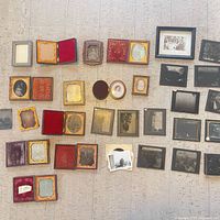 Full layout of cased photographs, glass negatives and frames