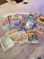 Group shot of all comics fanned on floor