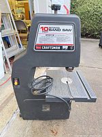 Full view of Craftsman 10-inch band saw showing housing, table, blade, cord