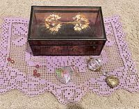 Overall lot with jewelry box, two prisms, locket and beads on purple lace