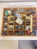 Top view of entire 36-compartment organizer with mixed fasteners and hardware