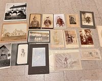 Group image of all 16 photographs laid out on floor