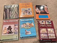 All six pottery and china reference books laid out front covers visible