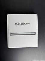 Retail box top showing USB SuperDrive branding and slot image