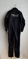 Rear view of black flight suit showing large Breitling Jet Team patch