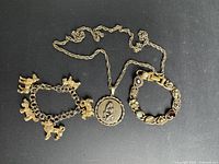 Overview of three jewelry pieces on black background