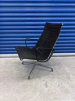 Front three-quarter view showing full chair, upholstery, base