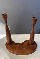 Front view of assembled teak double candle holder