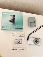 Camera, charger, manual and box overview