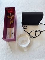 Rose in box, purse, paperweight overview