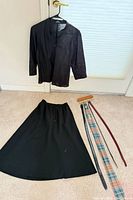 Full lot overview showing blouse, skirt, four belts