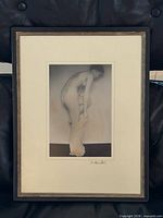 Full view showing framed photograph with mat and frame