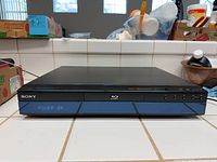 Front view of Sony BDP-S300 Blu-ray player powered on