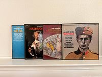 Front covers of Verdi Aida, Verdi Falstaff, Rossini The Barber of Seville, Berg Wozzeck