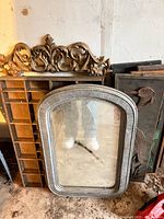 Group shot showing arched mirror, printer drawer with crest, carved panel