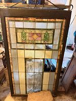 Full view of framed stained glass panel showing design and scale