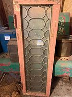 Full view of leaded glass panel in wood frame