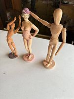 Three mannequins front view on table