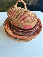 Stacked view of all baskets showing size gradation and colors