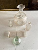 All six glass pieces grouped on table for overview