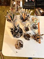 Overhead view of all brush holders filled with brushes on table