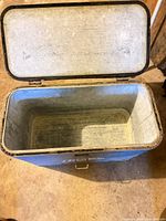 Cooler open showing galvanized interior