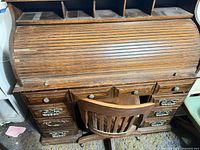 Full view of desk closed with chair in front