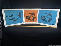 All three matted lithographs side by side with measuring tape