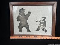 Full view of framed lithograph with ruler for scale