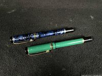 Both pens capped side by side