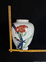 Front view showing full painted motif and measuring tape for scale