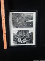 Front view of framed photographs with ruler showing size