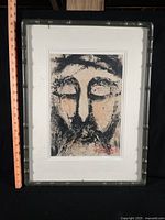 Full view of framed Suk Kang painting with measuring tape for scale