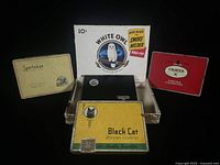 All tins and box grouped with White Owl box open