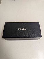 Closed Prada black outer box