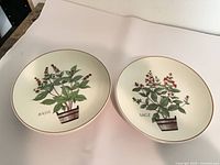 Two herb plates labeled Basil and Sage