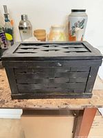 Small black wood box with lattice lid