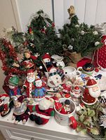 Overview of lot showing trees, wreath, figurines, mugs and ornaments