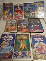 Group shot of ten Disney VHS tapes displayed on countertop