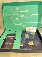 Open D23 collector box showing passport booklet and interior layout